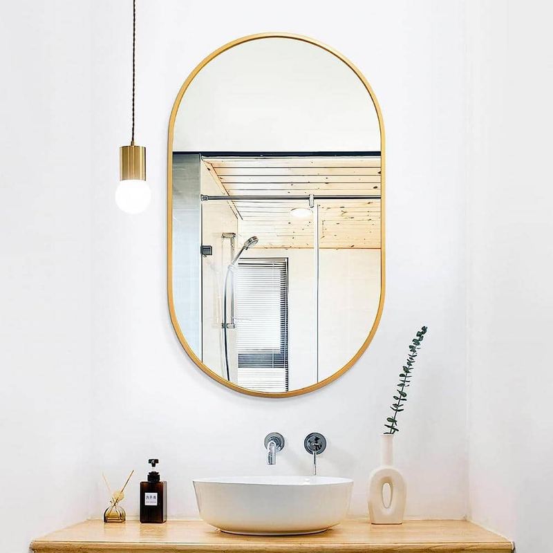 Nestfair - 20 in. W x 33 in. H Gold Oval Brush Metal Framed Vanity Mirror