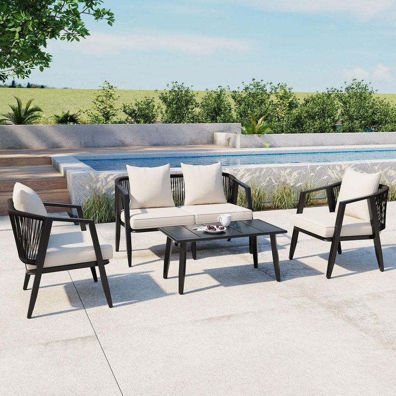 Harper & Bright Designs - 4-Piece Black Metal Patio Conversation Set with Beige Cushions and Coffee Table